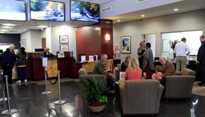 Grand Opening guests in front of video wall